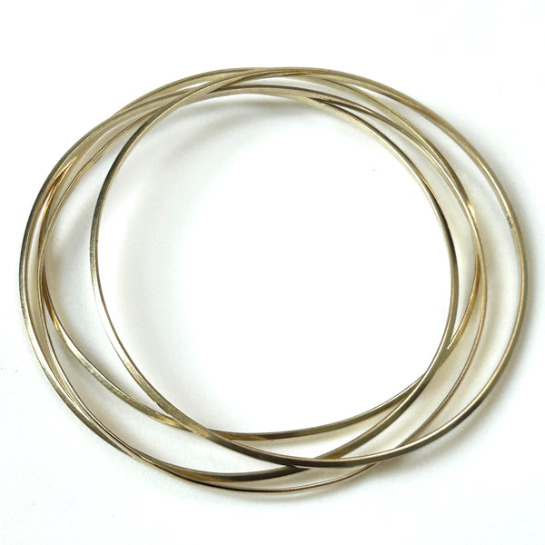 Four 9ct Gold Bangle Bracelets